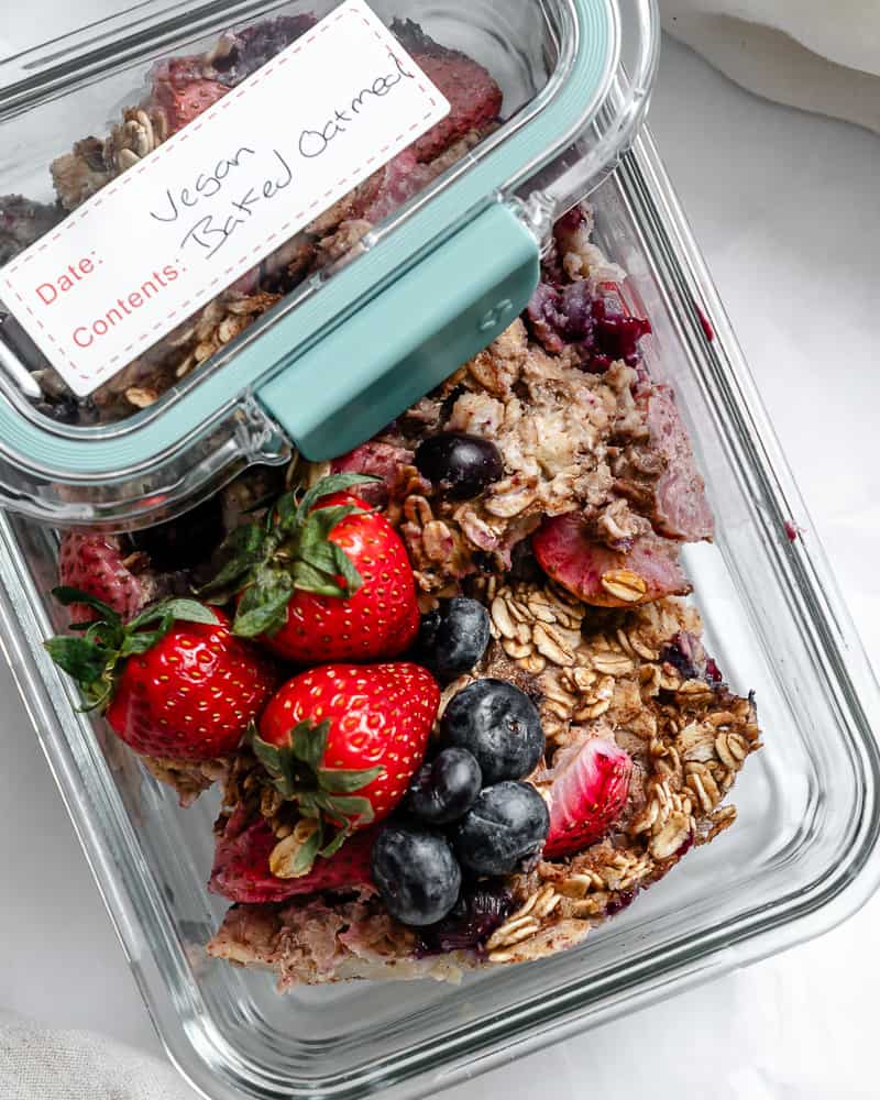 completed Vegan Baked Oatmeal [With Berries] in a storage container
