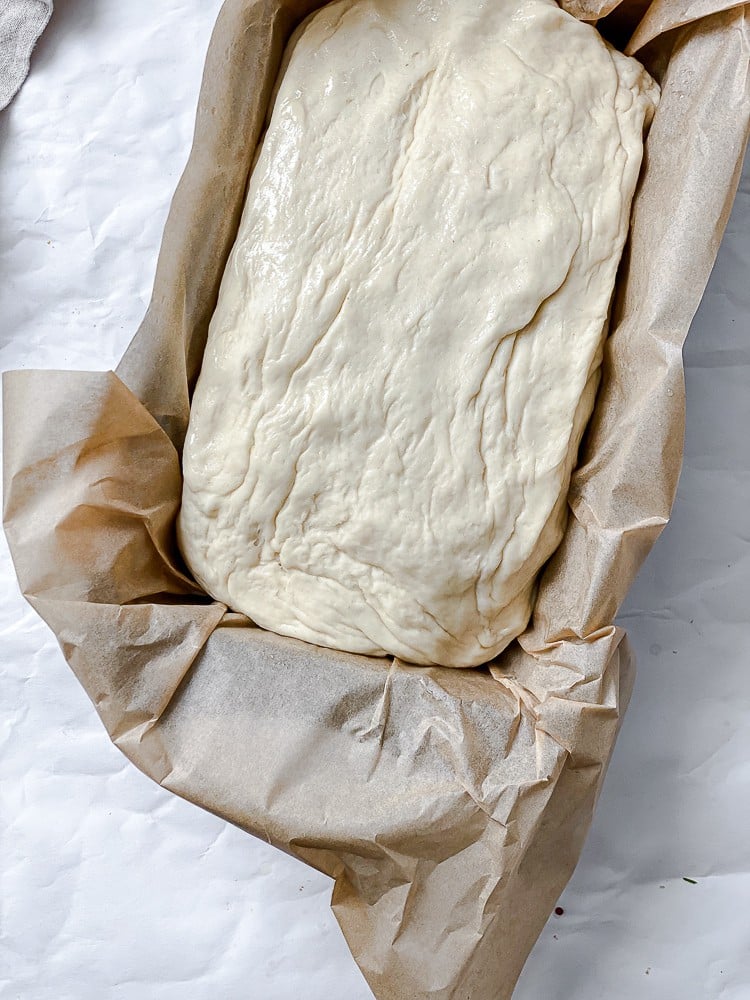 process shot showing dough in bread pan