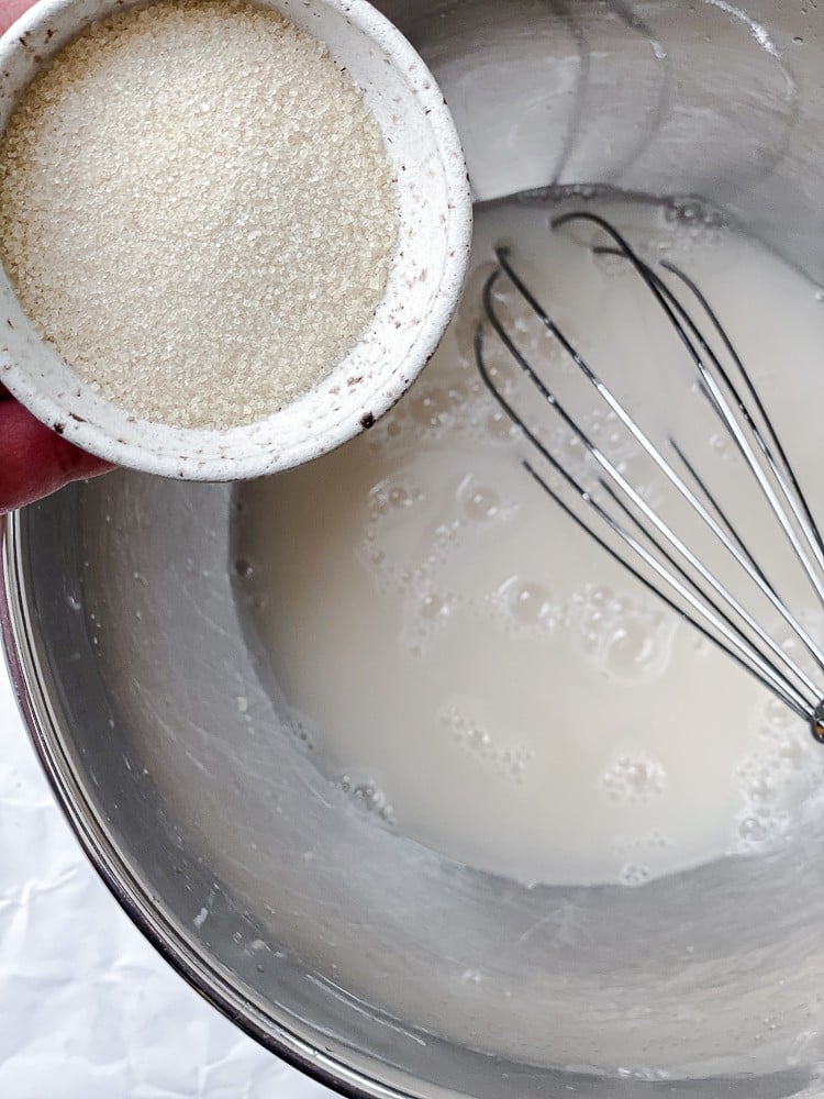 process shot of adding ingredients to bowl