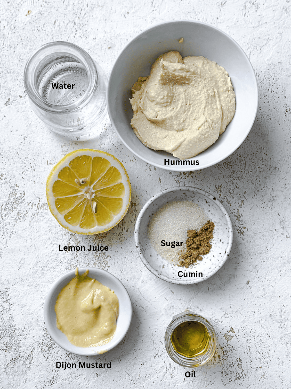 ingredients for Easy Hummus Dressing on white surface