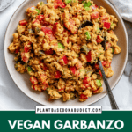 pinterest image of vegan garbanzo bean salad in a large white bowl.