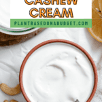 pinterest image of creamy white cashew cream in a small bowl.