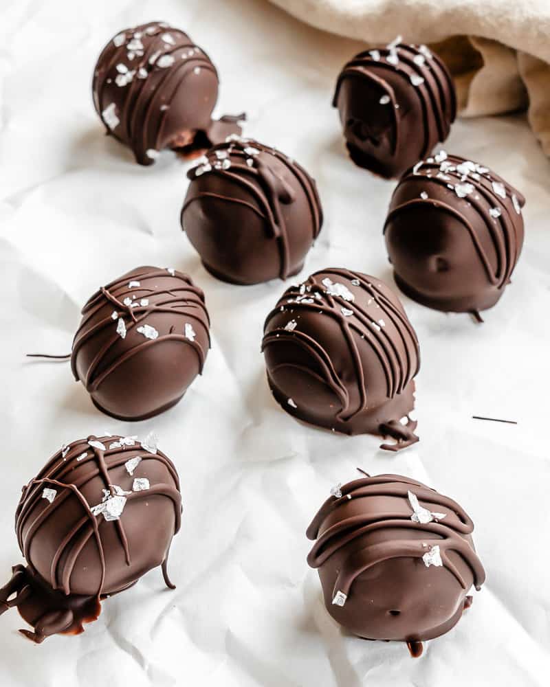 completed 3-Ingredient Chocolate Coconut Balls on a white surface