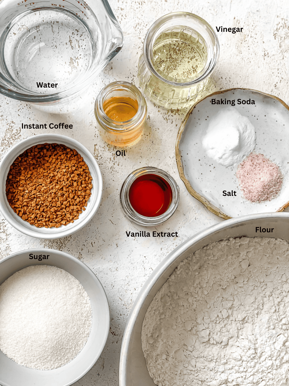 ingredients on a white surface for Easy Coffee Cupcakes