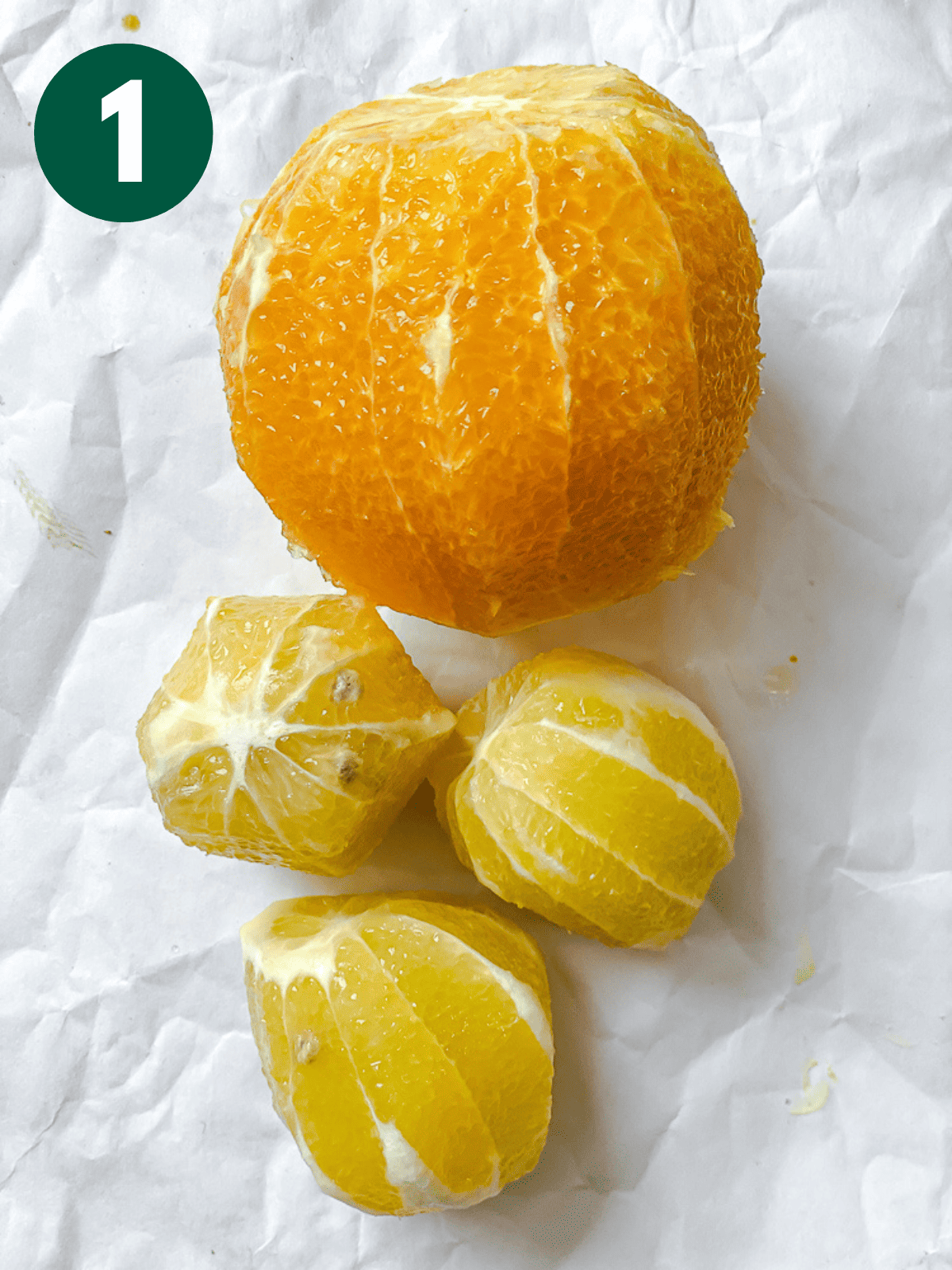process shot showing peeled lemons and oranges