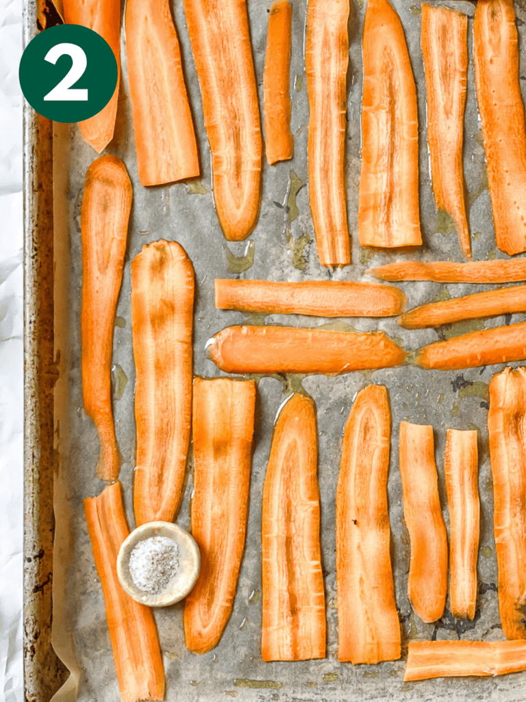 process shot showing carrots on baking tray