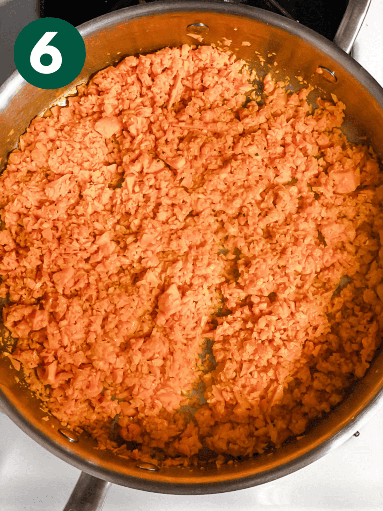 process shot showing sweet potatoes cooking in pan