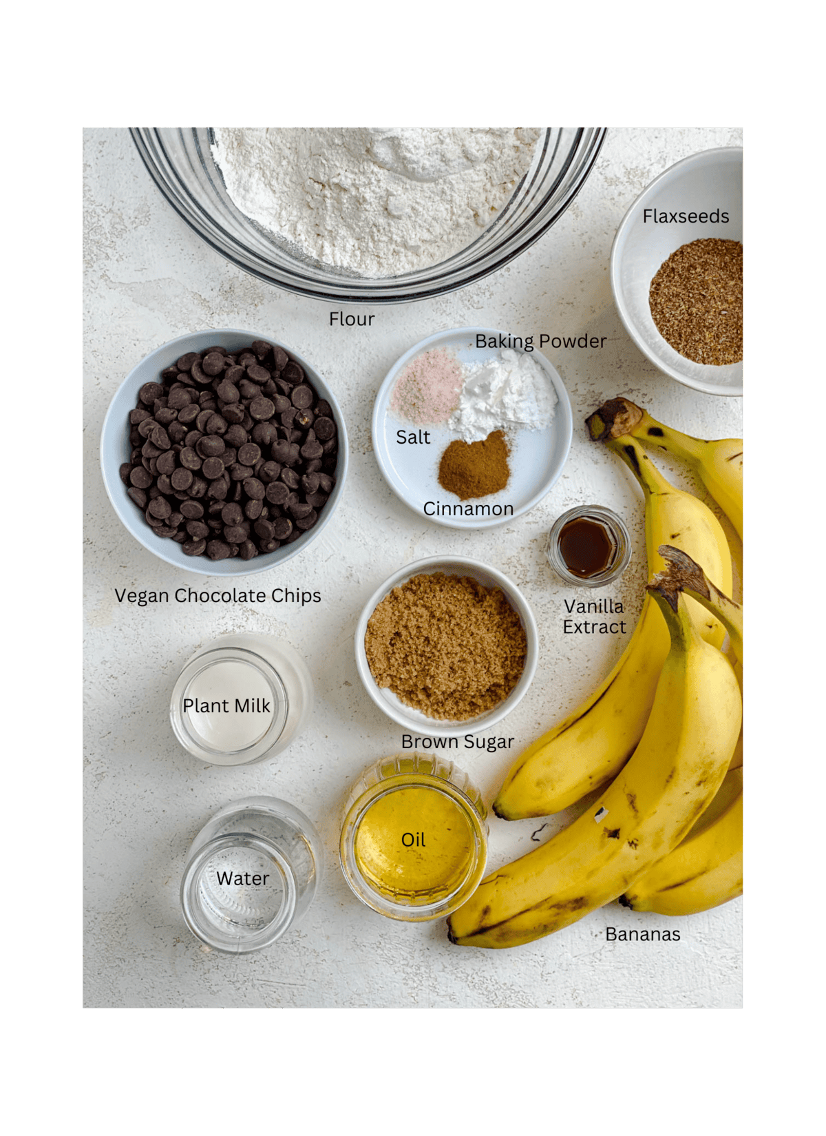 ingredients for Banana Chocolate Chip Bars measured out on a white surface