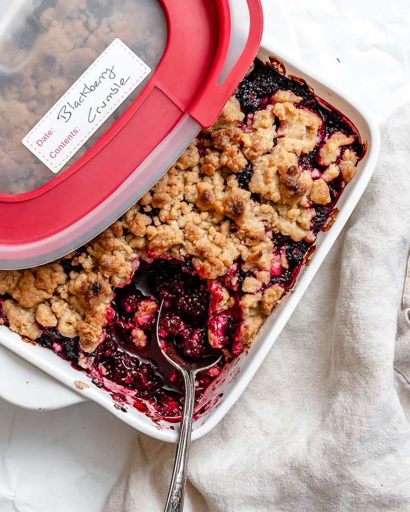 completed Easy Blackberry Crumble in storage dish