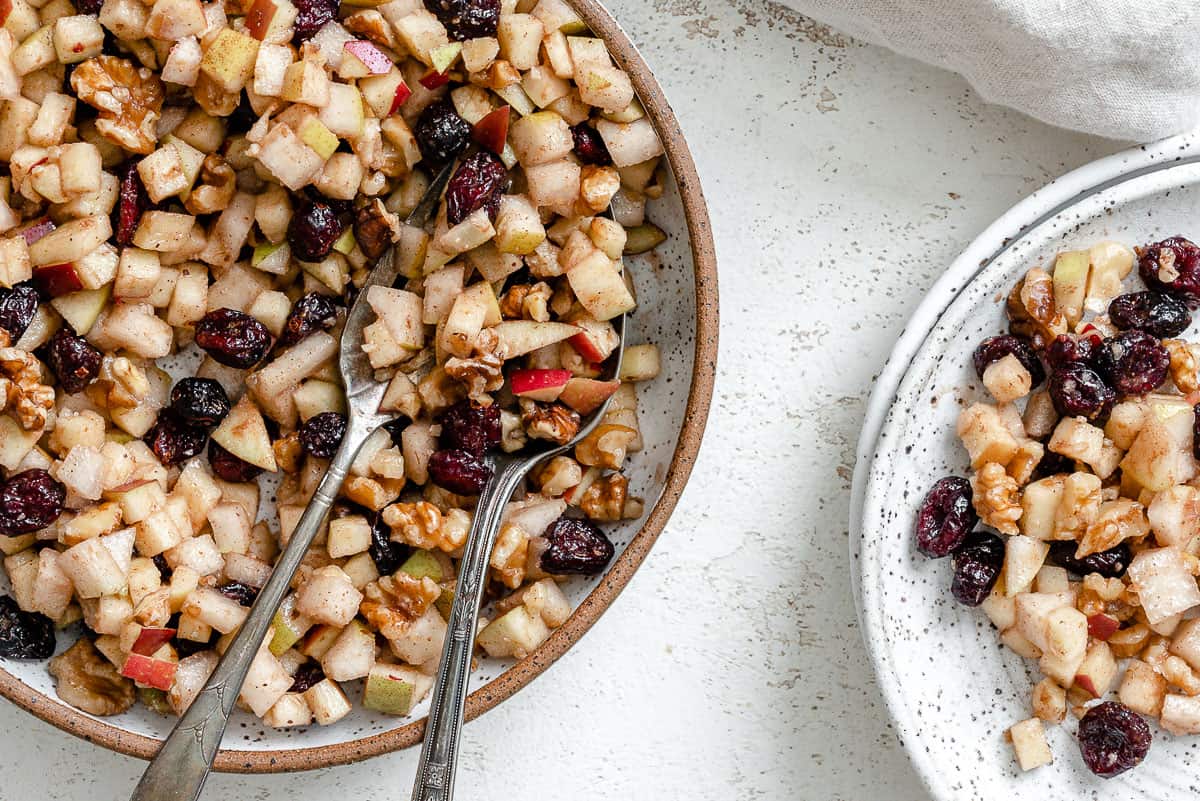 serving chunky charoset on white plates.