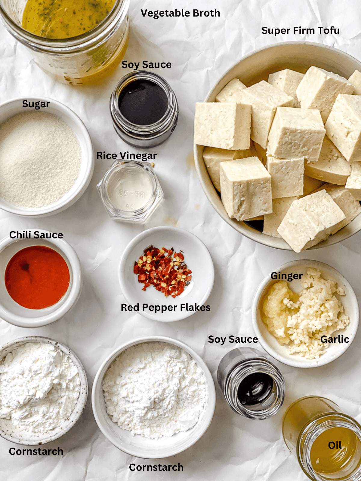 ingredients for General Tso's tofu in individual white bowls.