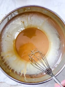 Cornstarch and soy sauce whisked together in a metal bowl