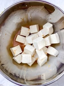 Tofu cubes added to the soy sauce and cornstarch mixture