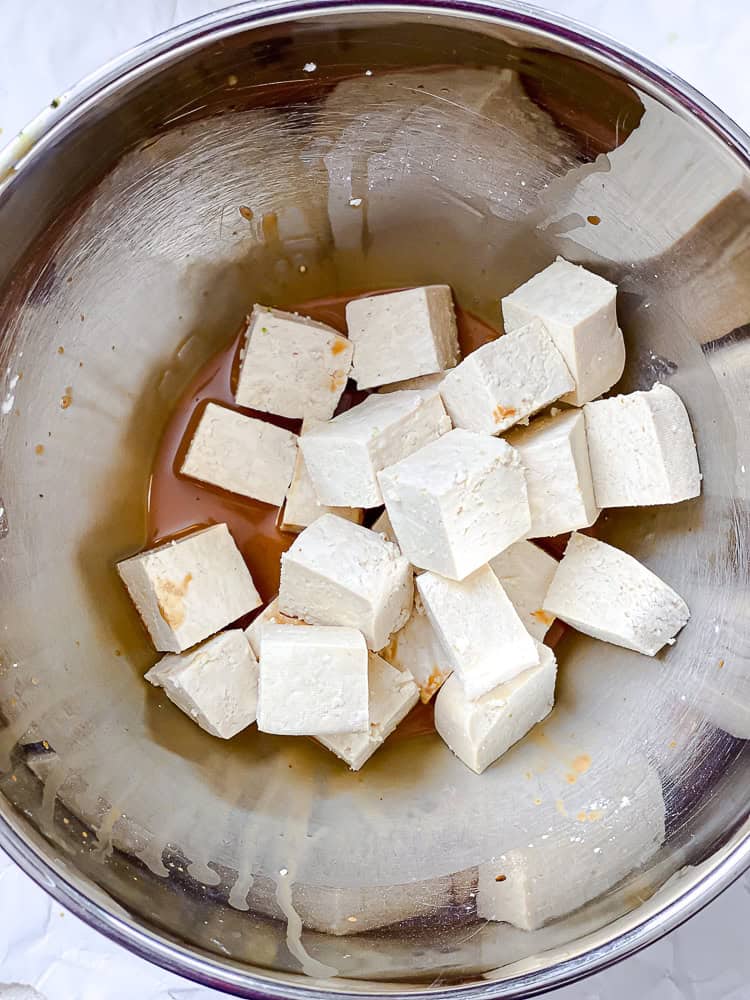 Tofu cubes added to the soy sauce and cornstarch mixture