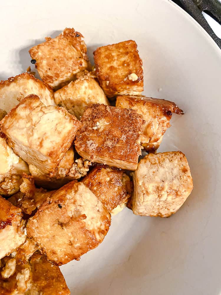 Fried tofu cubes in a white bowl