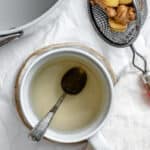 completed ginger tea in a cup against a white background