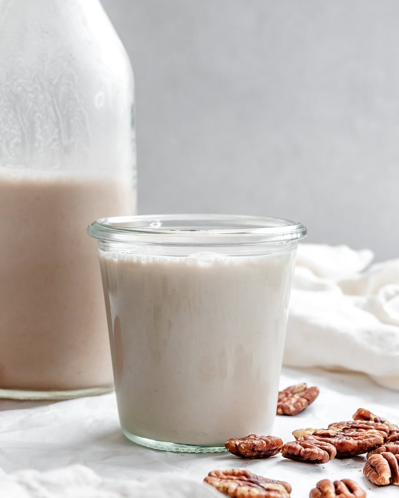 completed pecan milk in jar and cup