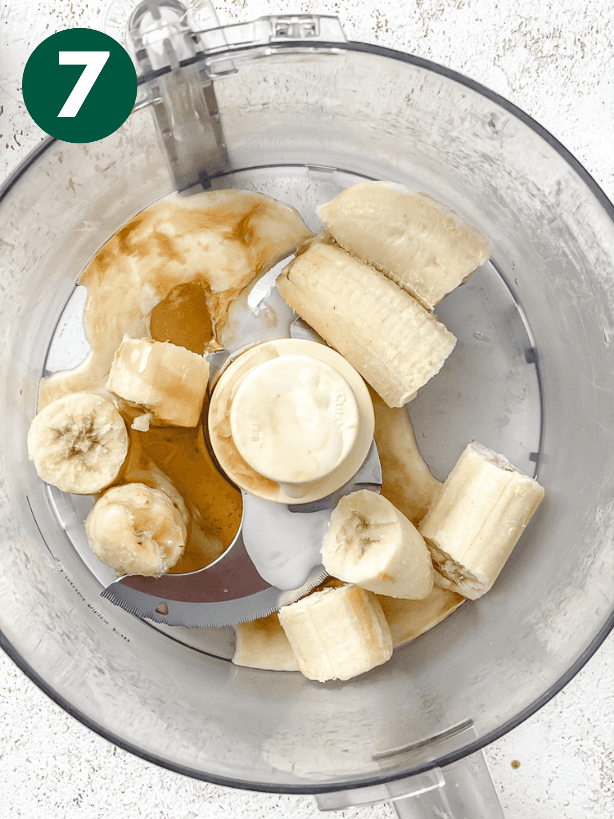 ingredients for banana ice cream in a food processor.