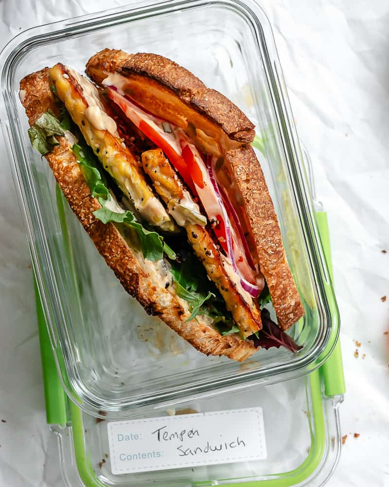 completed Tempeh Sandwich in a storage container