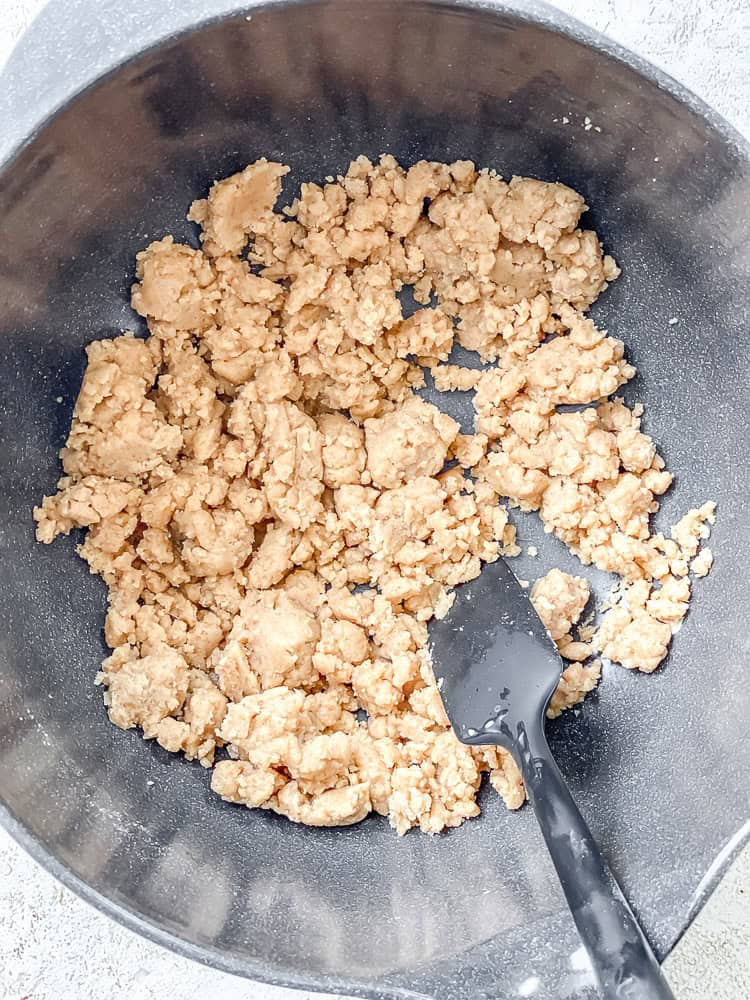 Process shot showing stirring ingredients in a bowl.