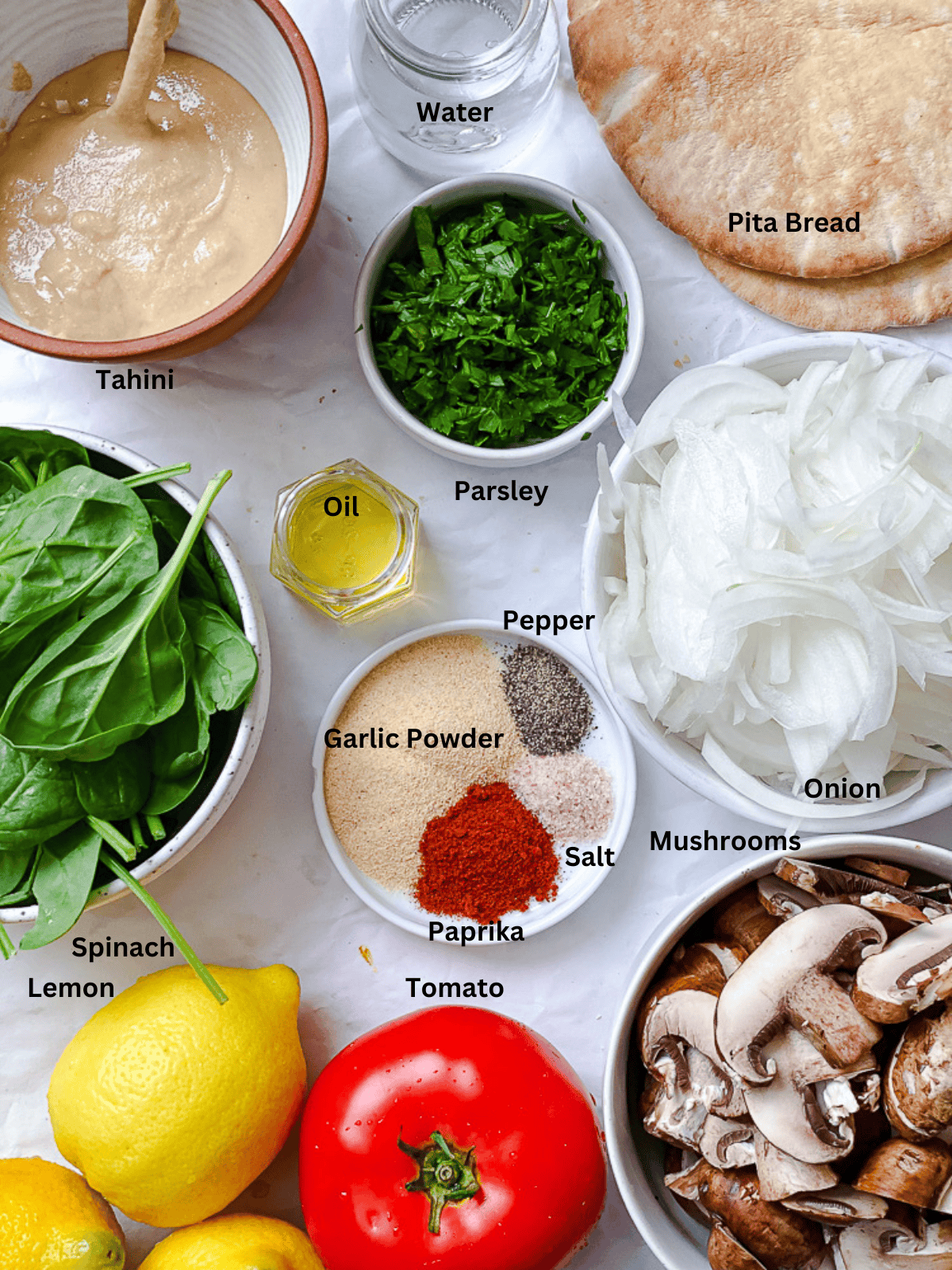 ingredients for a vegan mushroom sandwich in individual bowls.