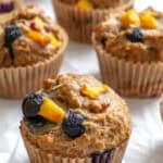 completed Blueberry Peach Muffins on white surface