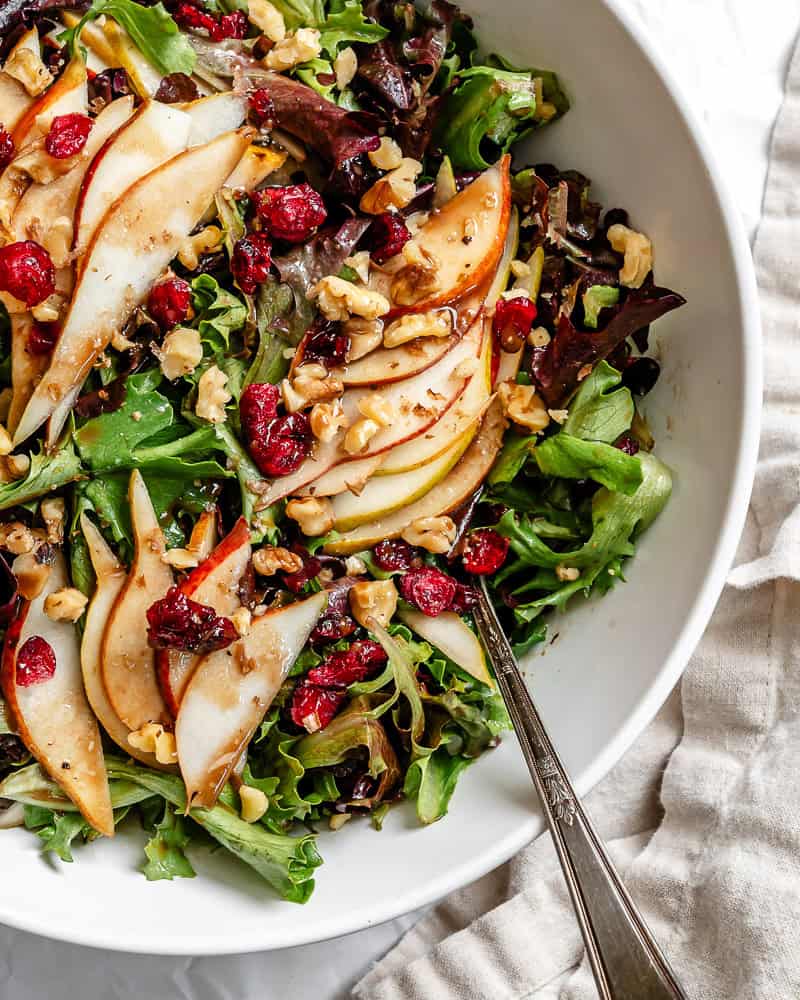 close up on pear salad in a large bowl.