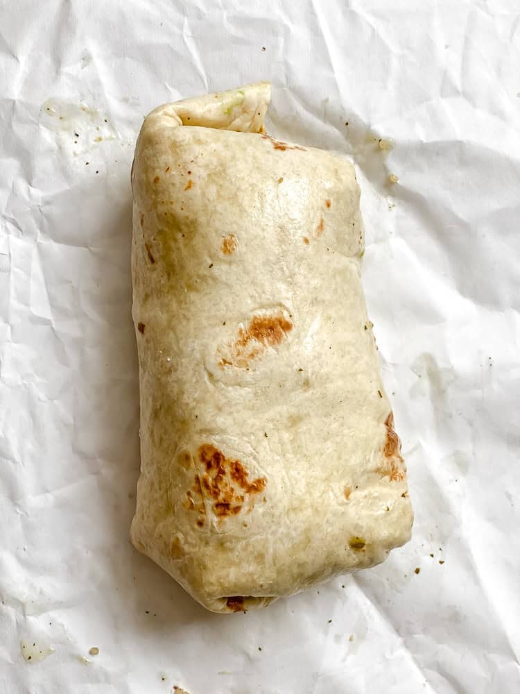 process shot showing wrapped burrito in tortilla