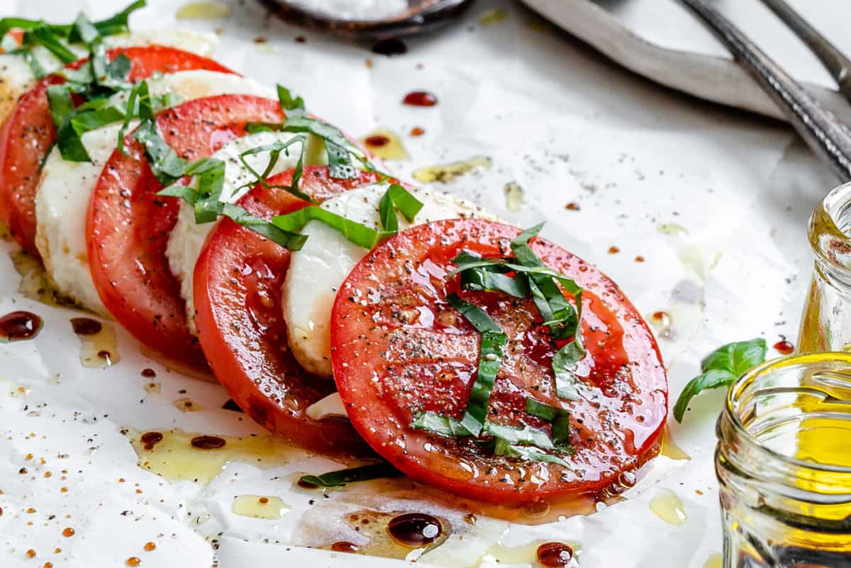 completed Vegan Caprese Salad on a white surface