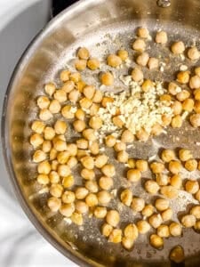 process shot showing chickpeas cookin in pan