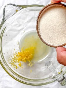 process shot showing adding sugar to food processor