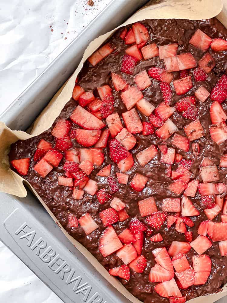 process shot showing strawberries added to mixture in pan
