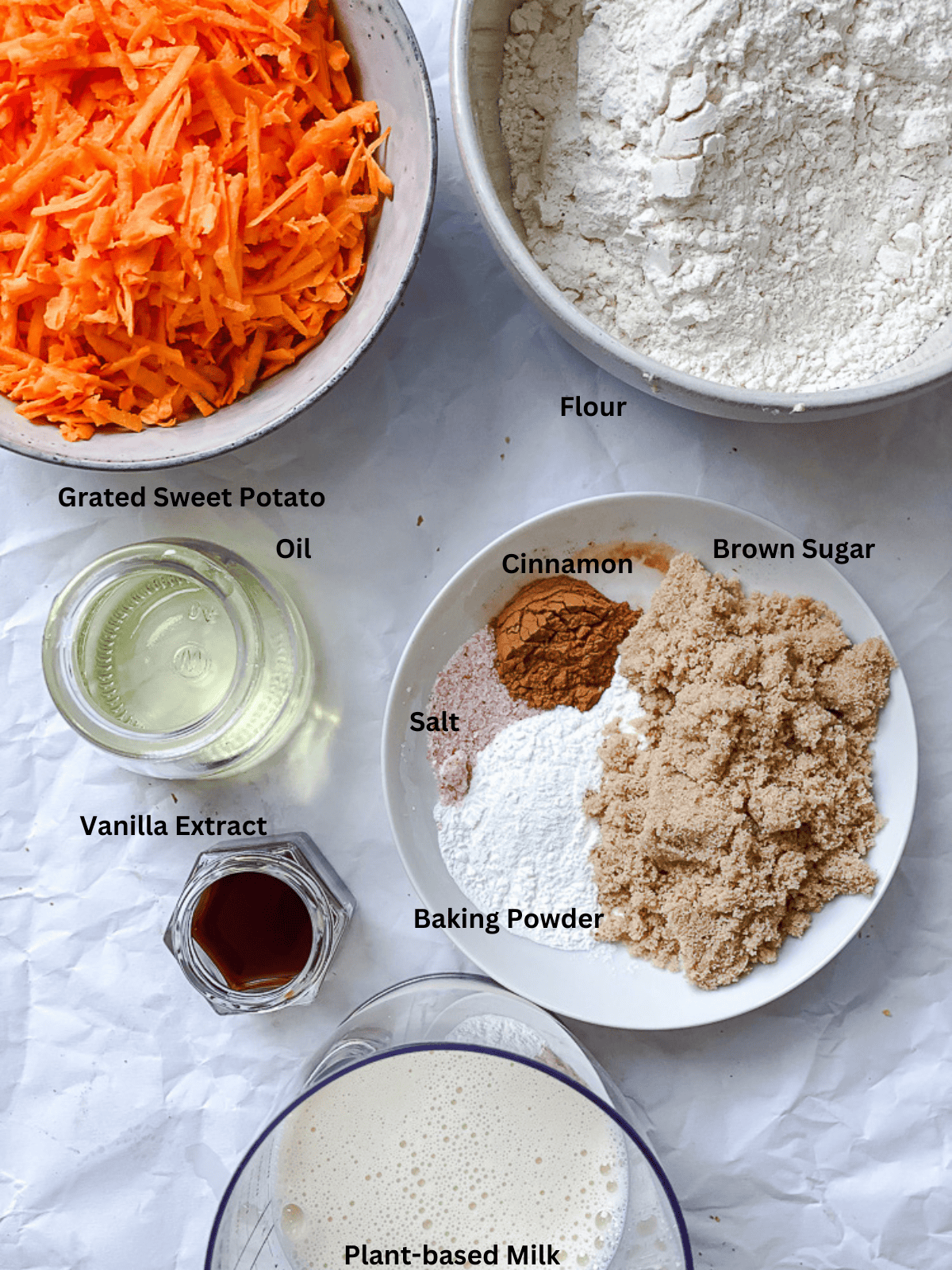 ingredients for Sweet Potato Bread measured on a white surface