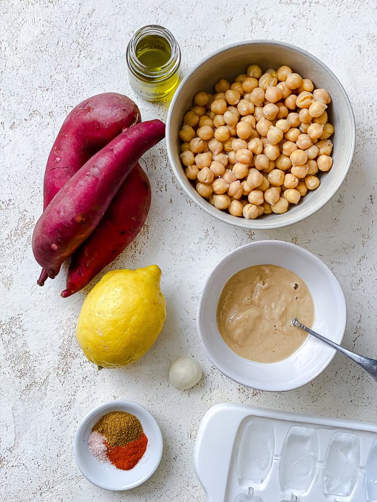 ingredients for sweet potato hummus in individual white bowls.