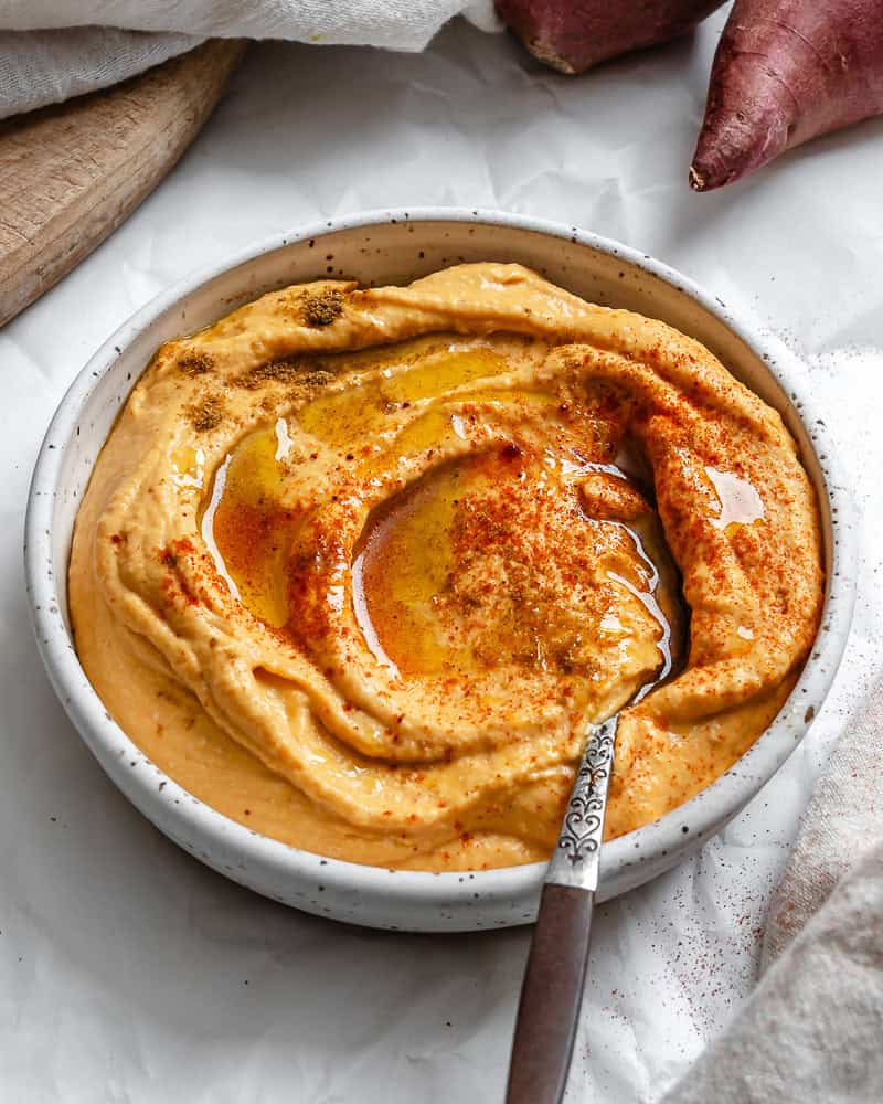 sweet potato hummus in a white bowl.