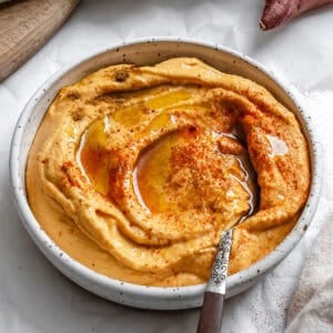 sweet potato hummus in a white bowl.