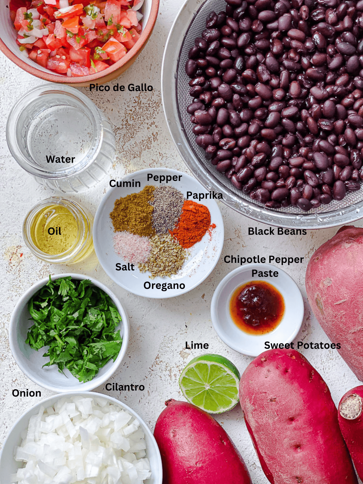 ingredients for Sweet Potato and Black Bean Tacos measured out on a white surface