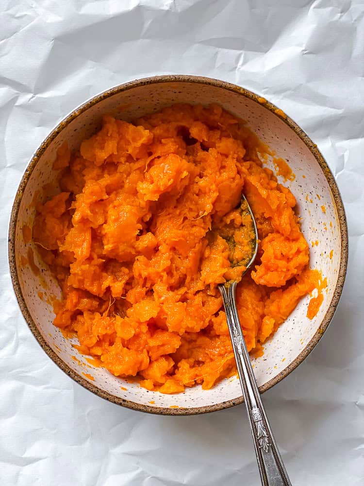 process shot showing mashed sweet potatoes in bowl