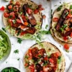 completed Easy Tempeh Tacos on a white surface