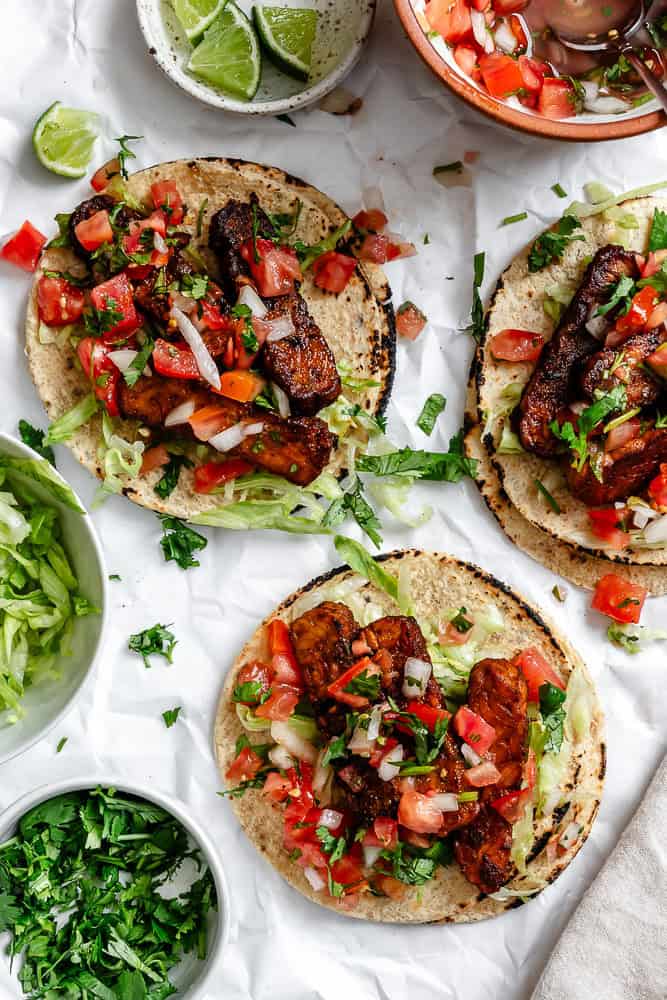 completed Easy Tempeh Tacos on a white surface