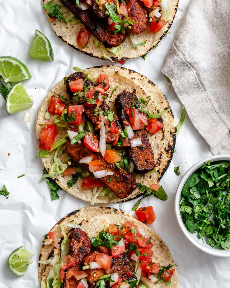 completed Easy Tempeh Tacos on a white surface