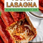 pinterest image of vegan lasagna with a slice removed in a white baking dish.