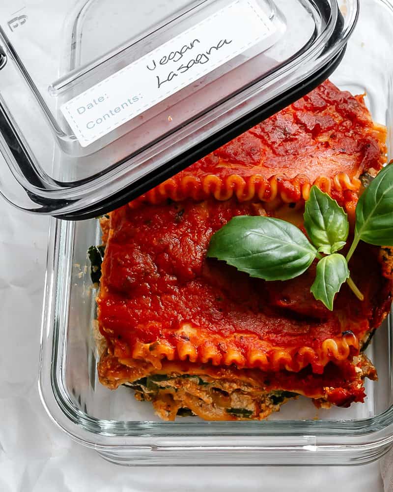 a piece of vegan lasagna in a storage container.
