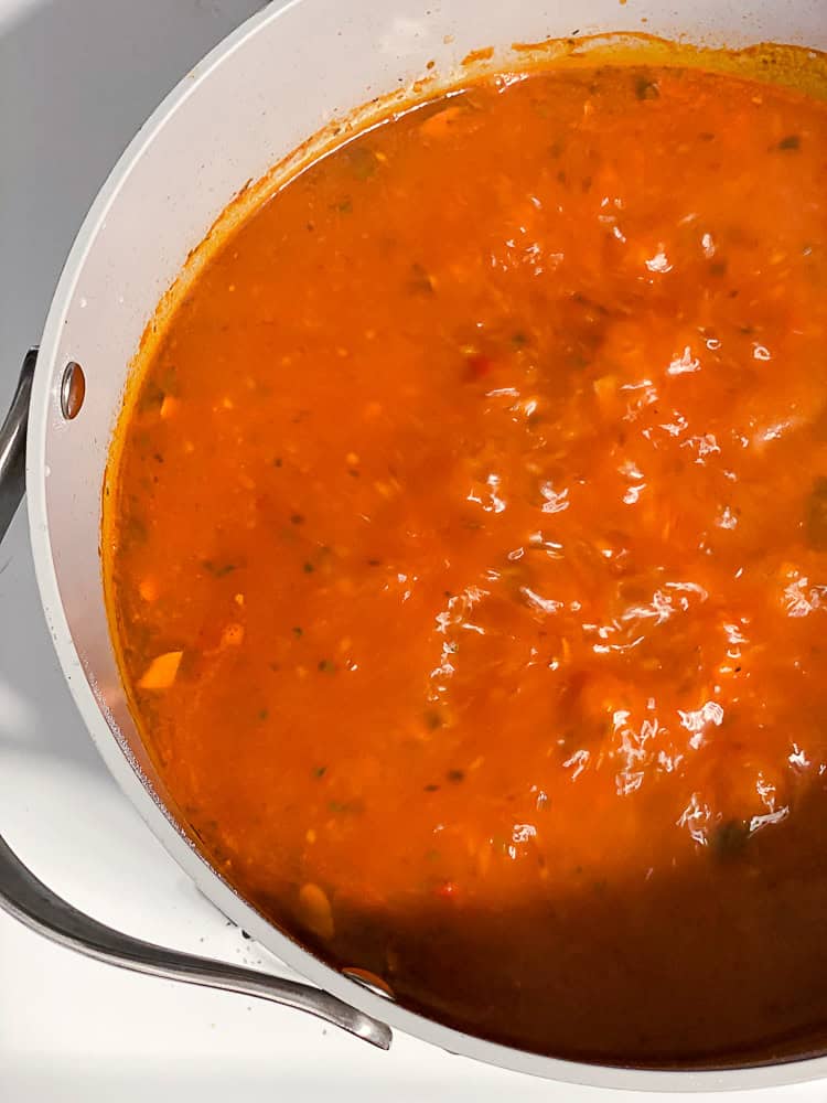 a pot of boiling lasagna soup.