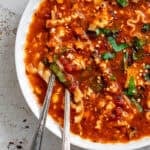 vegan lasagna soup in a white bowl.