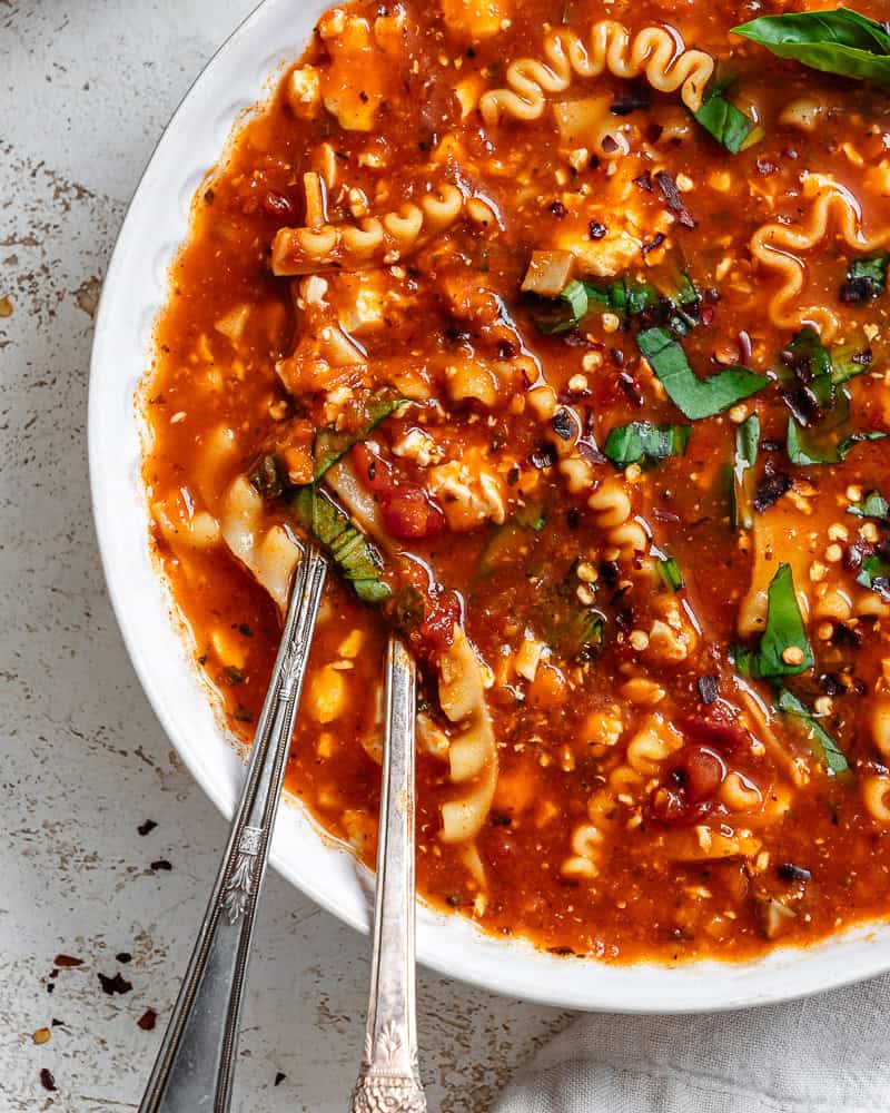 vegan lasagna soup in a white bowl.