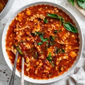 vegan lasagna soup in a white bowl.