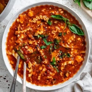 vegan lasagna soup in a white bowl.