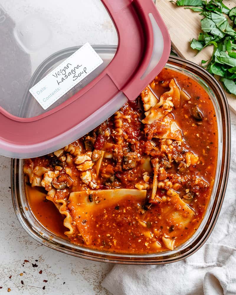 leftover vegan lasagna soup in a storage container.