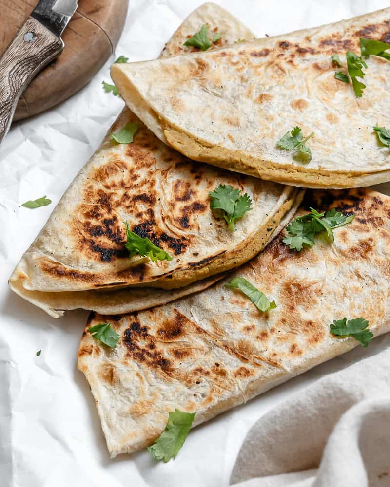 3 Vegan Bean Quesadillas piled on top of each other.
